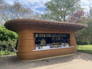 View of Colicci Hotdogs food stand from foot path.