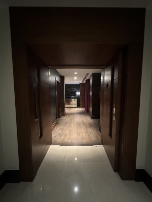 Main entrance after hotel pathway. Preceding double wood doors, push. Straight ahead The Penn reception countertop.