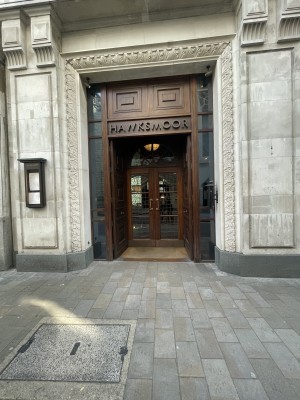 From street. Doors in middle of building. Two sets of double doors. First set are push doors to be pushed from middle if not fixed open. Second doors are pull to be pulled from centre of double doors using handle at centre height of the door.