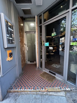 Small step leading to main entrance, door then to the right.
