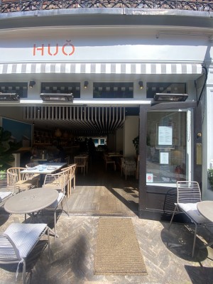 View of the main entrance looking straight ahead. Chairs to the left and right. Pull door.