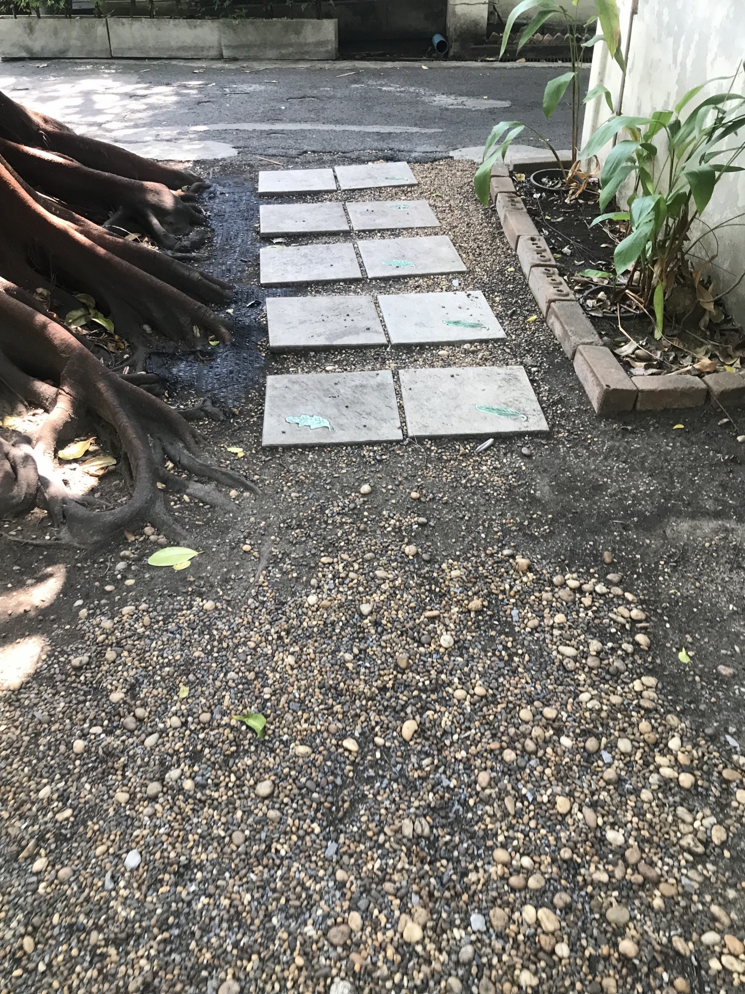 Pathway to outdoor tables - gravel & river pebbles and concrete pavers