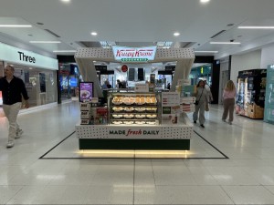 Counter with products on display at front. Ordering area on left.