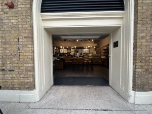 From inside station facing venue. Wide open archway ahead.