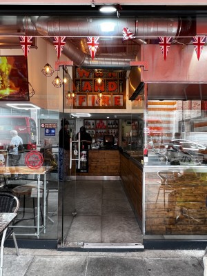 Glass door ahead. Silver vertical metal handle to right. Push to open.