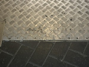 Metal ridge at entrance.