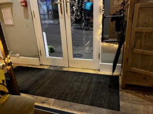 One door was locked so wouldn’t be able to fit a wheelchair through without requesting both doors are opened.