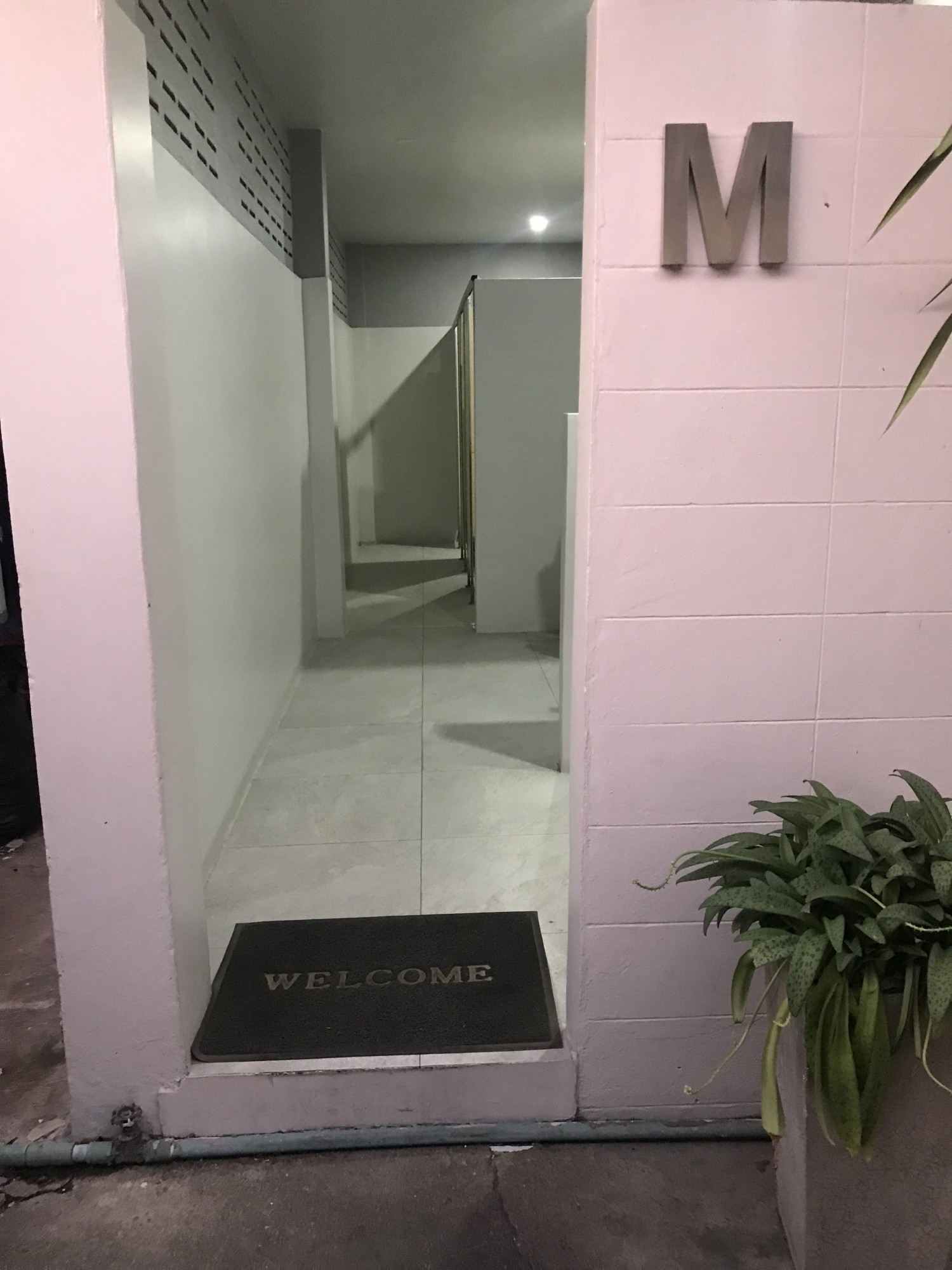 Inside bathroom - entrance to mens with 10-15 cm step up