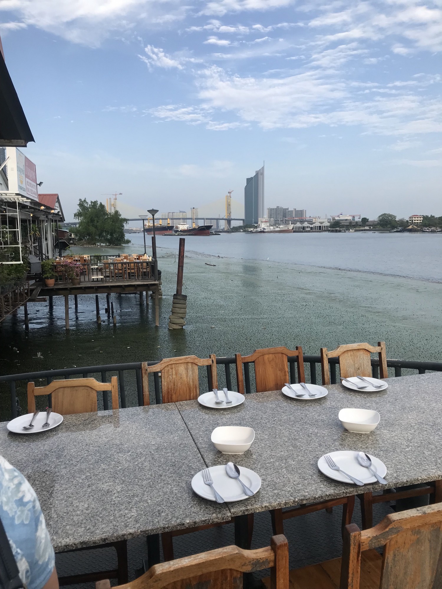 Dining outside by the river - one step 15 cm to get to this table