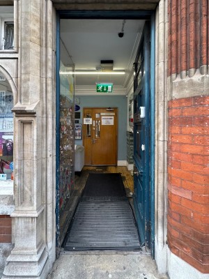 First blue wooden proceeding door. Push from left to open.