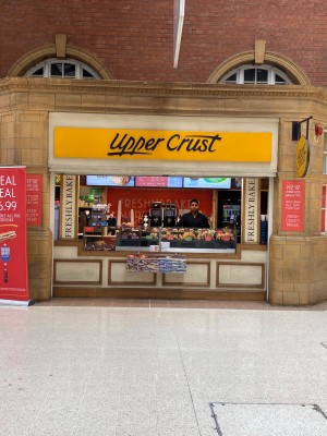 Uppercrust retail area. Go up to retail area/entrance located up back straight ahead from underground station.