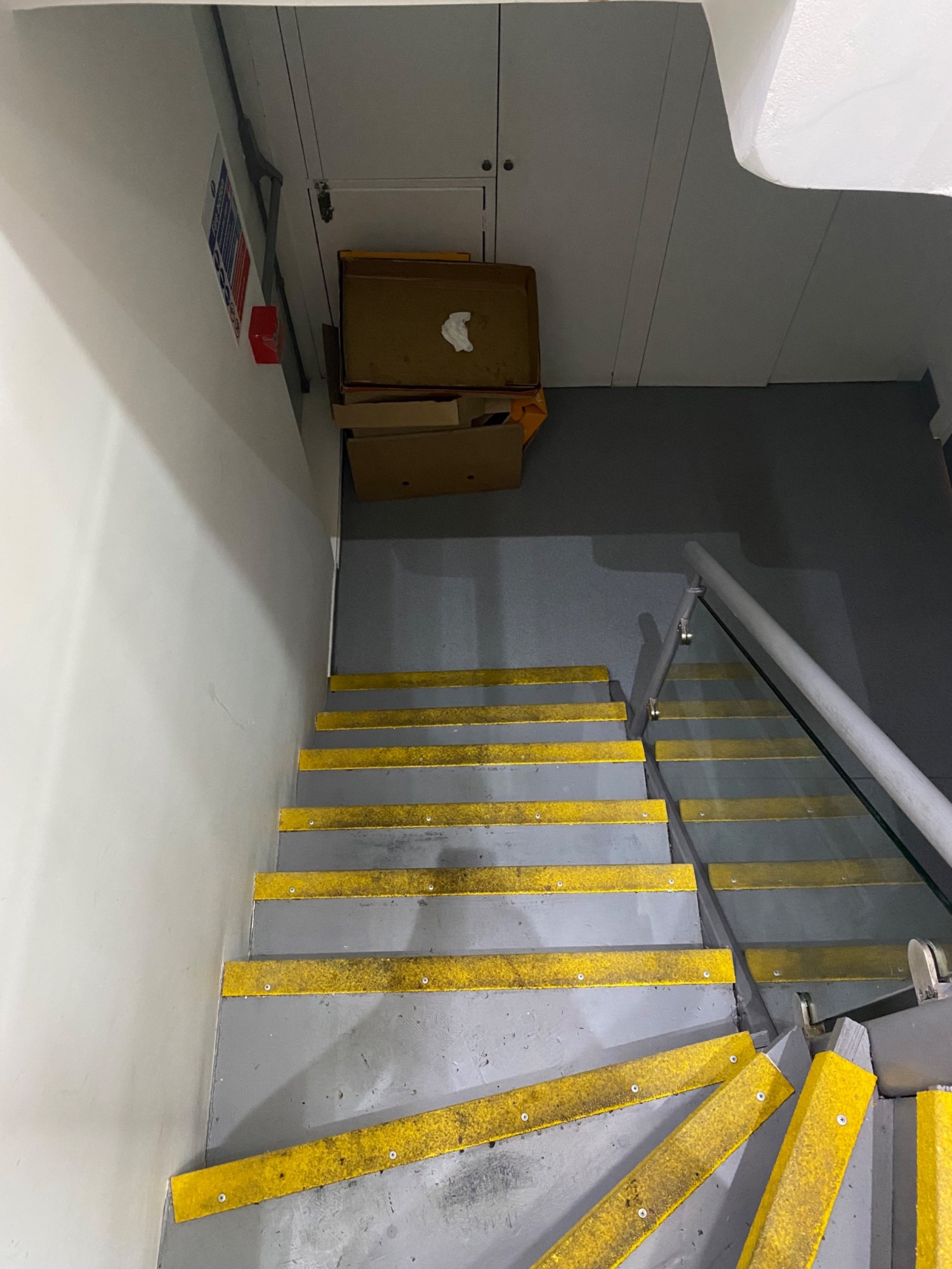 Go straight down six steps after the three curved steps. Handrail on right behinds at this point.
