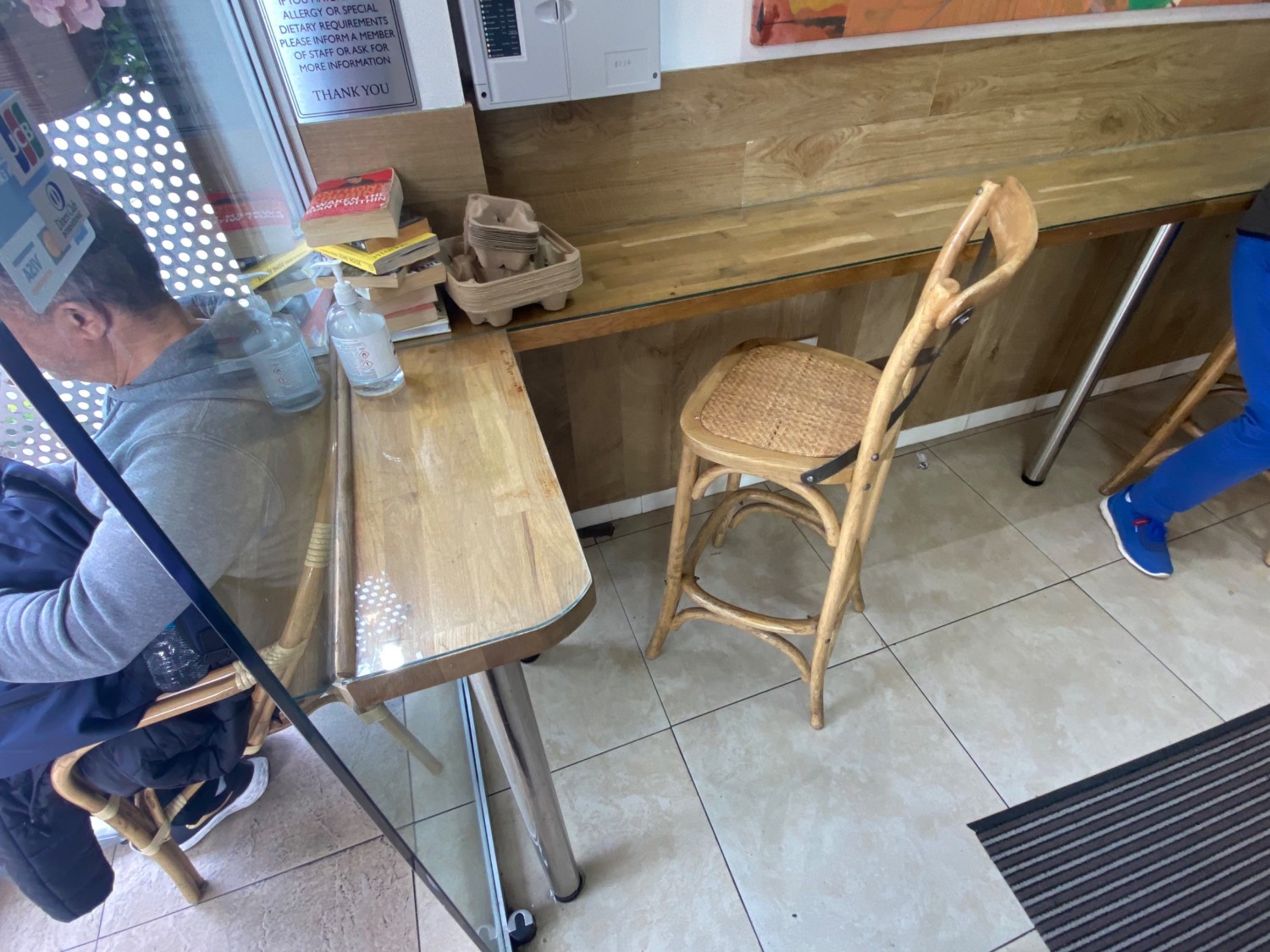Standing from entrance looking left. High tables with backed-stools.