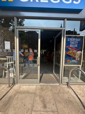 Double doors at main entrance. Push doors open from center. Small bump at the foot of the doors.