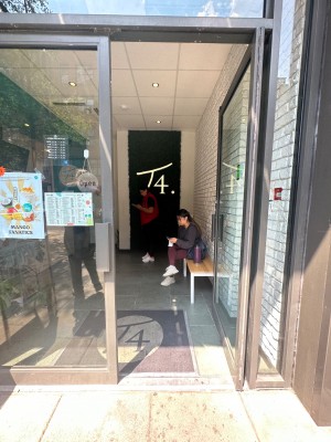 Main entrance. Single glass door with handle on the right. Push.