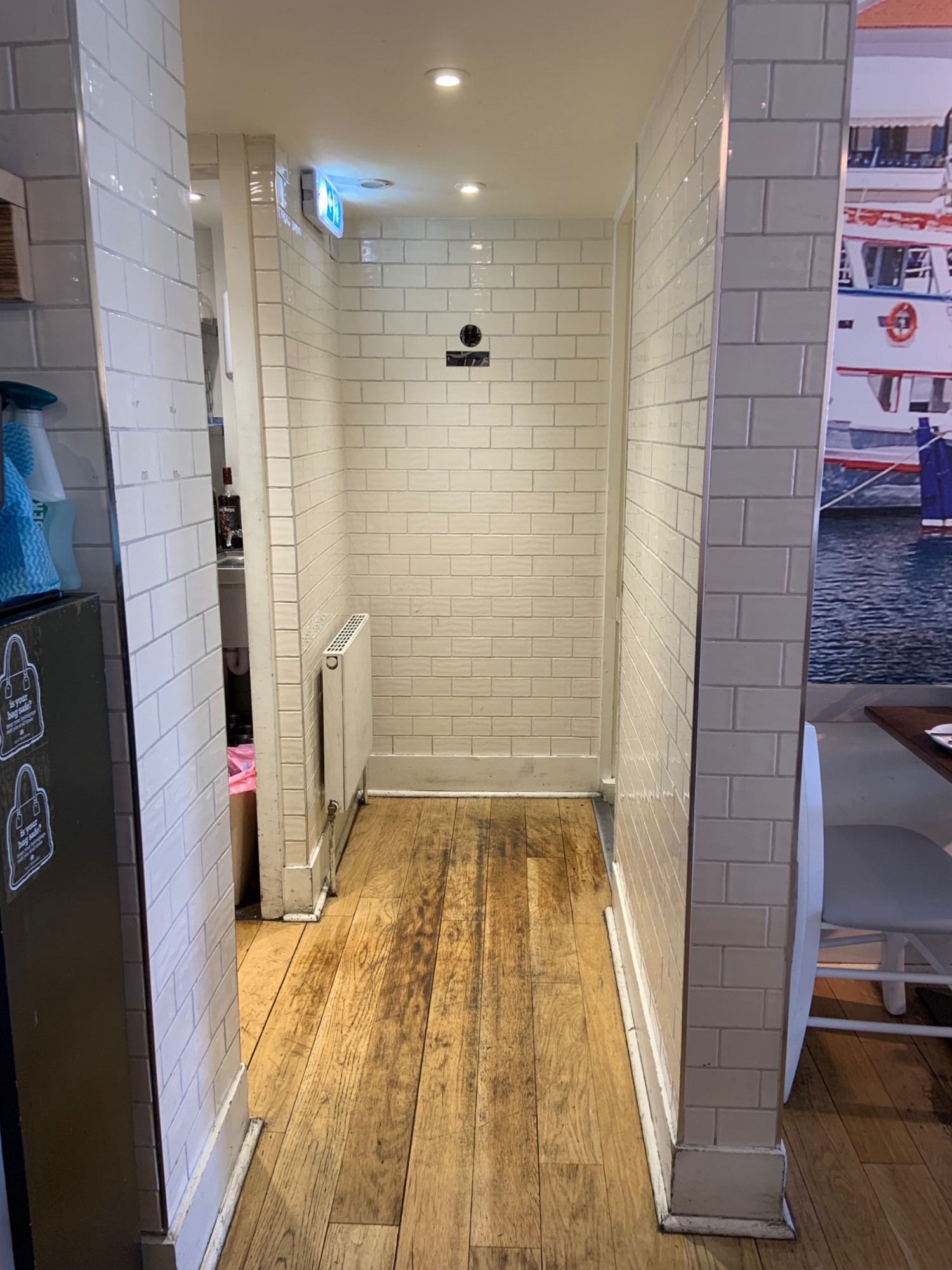 View from archway to corridor to stairway. Archway to stairway in back right corner.