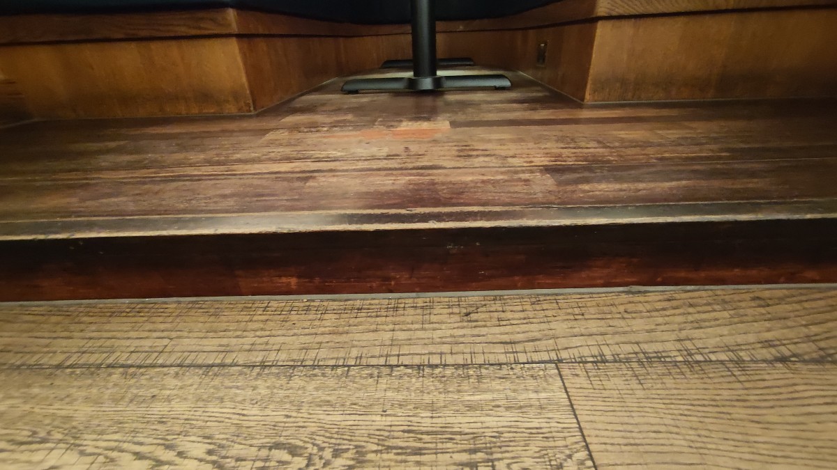 Small step at foot of curtains.