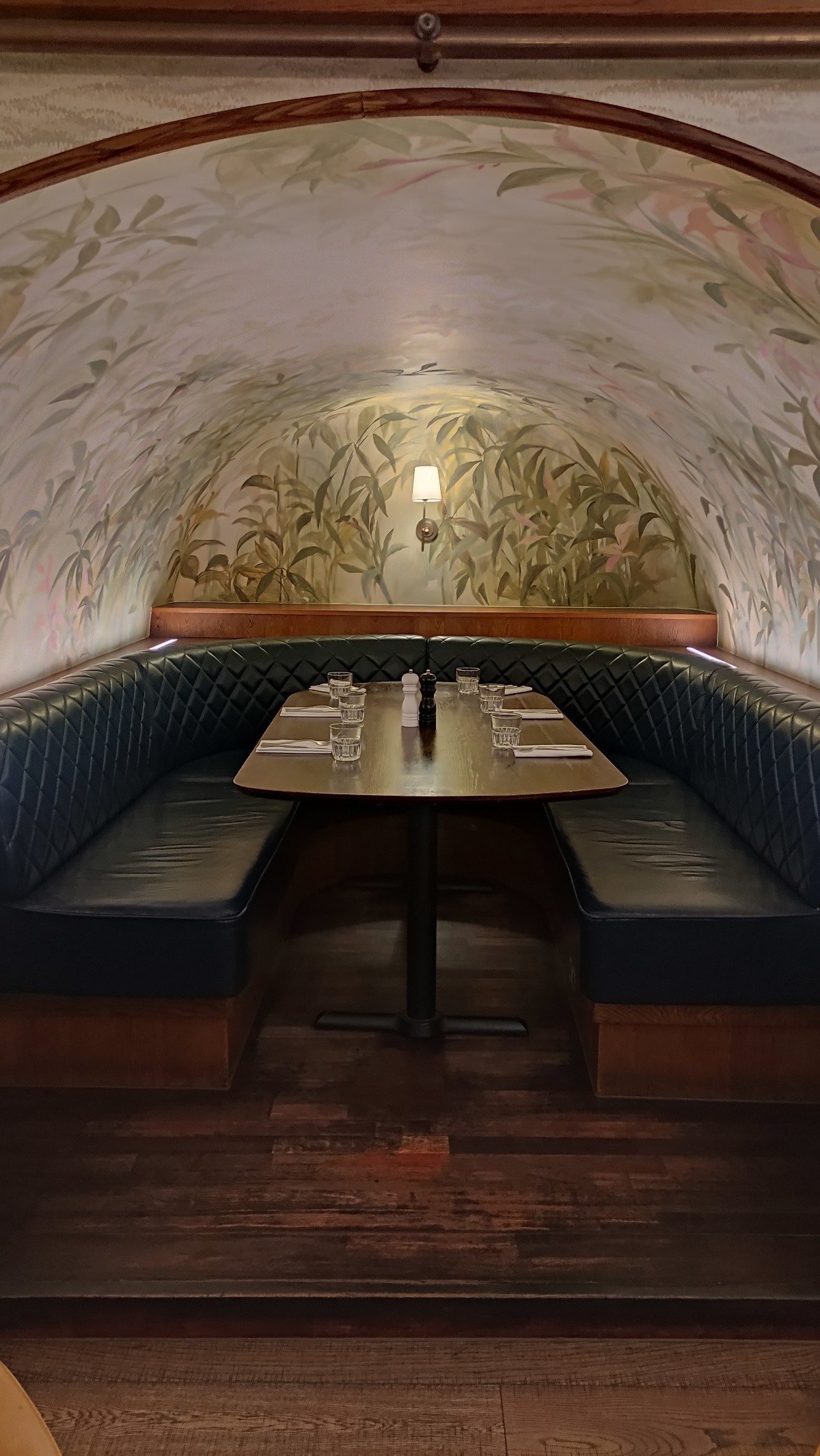 From end of half booth facing left. Navy curtains ahead. Pull on either side to enter booth.