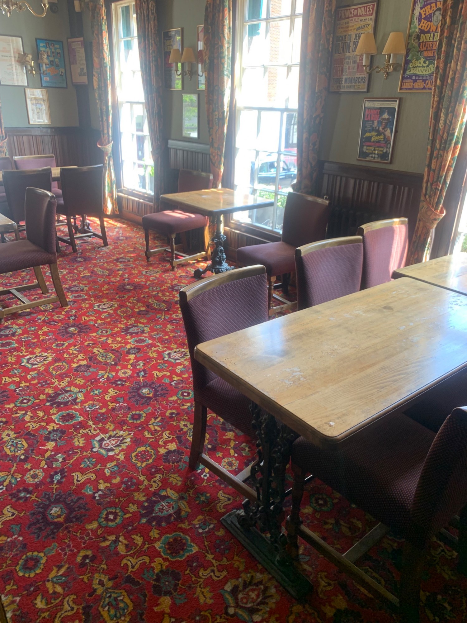 From door facing left. Tables and chairs along right.