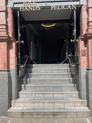 Staircase leading up to a set of double doors. Doors pull open from the middle.