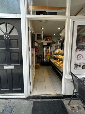 Main entrance. Single wood door. Push. Handle on the right.