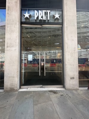 Main entrance. Double glass door with handles on the center. Push.