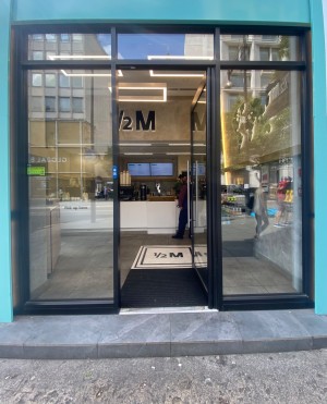 View of main entrance looking straight ahead.   Push to open. Press for assistance button left side.
