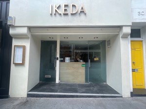 From the street looking straight at main entrance. One step up to main door.