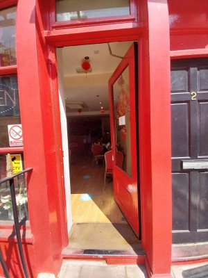 Main entrance to the right of venue from street. Manual door push open from left.