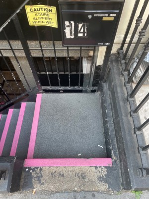 Taken from street. One step then platform . After platform stairs to the left.
