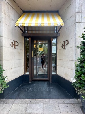 Main entrance. Single glass door straight ahead. Push.