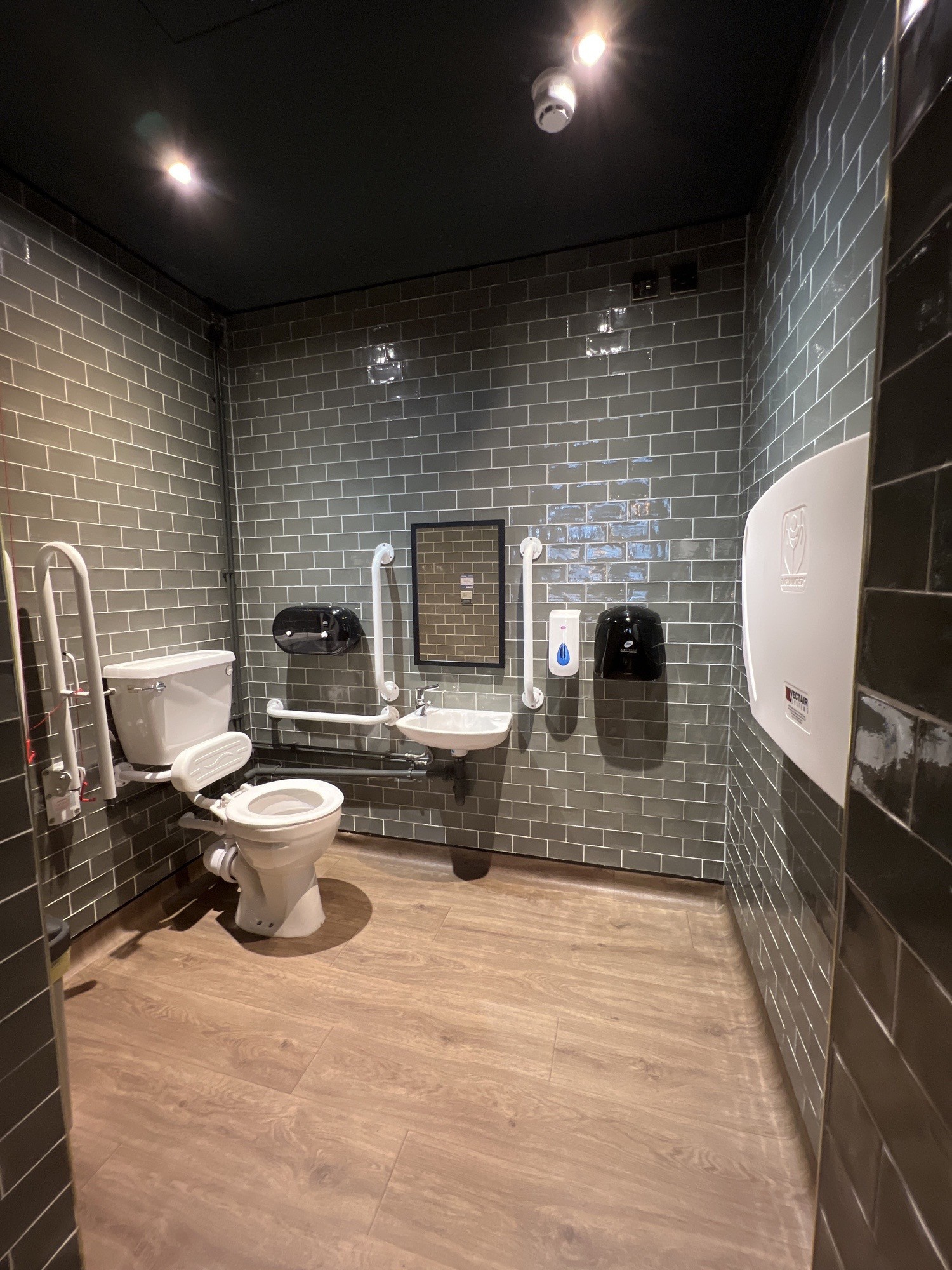 Upon entering, bathroom is on the left, sink is straight ahead, baby change is to the right.