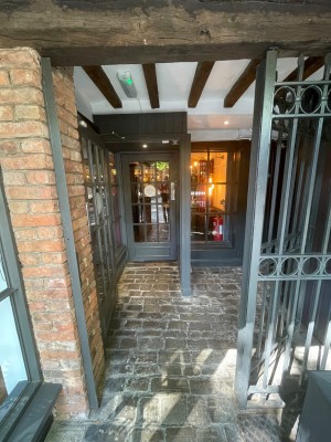 First door is a push door. Push from the left if not already opened. After there is a path to the left leading to the next door.