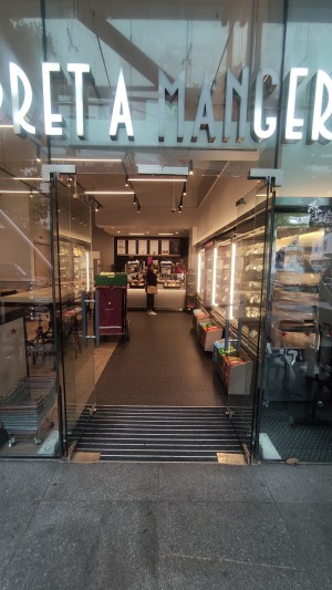 Glass doors. Push via vertical metal handles in centre to open.
