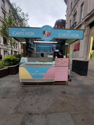 From street facing venue. Stall counter ahead. Order and pay on right.
