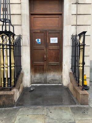 View of alternative entrance to right side of hotel. Doors must be opened by staff.