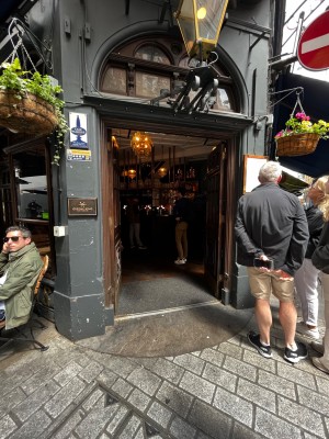 Main entrance door. Small bump at foot of  door. Double doors. Push to enter.