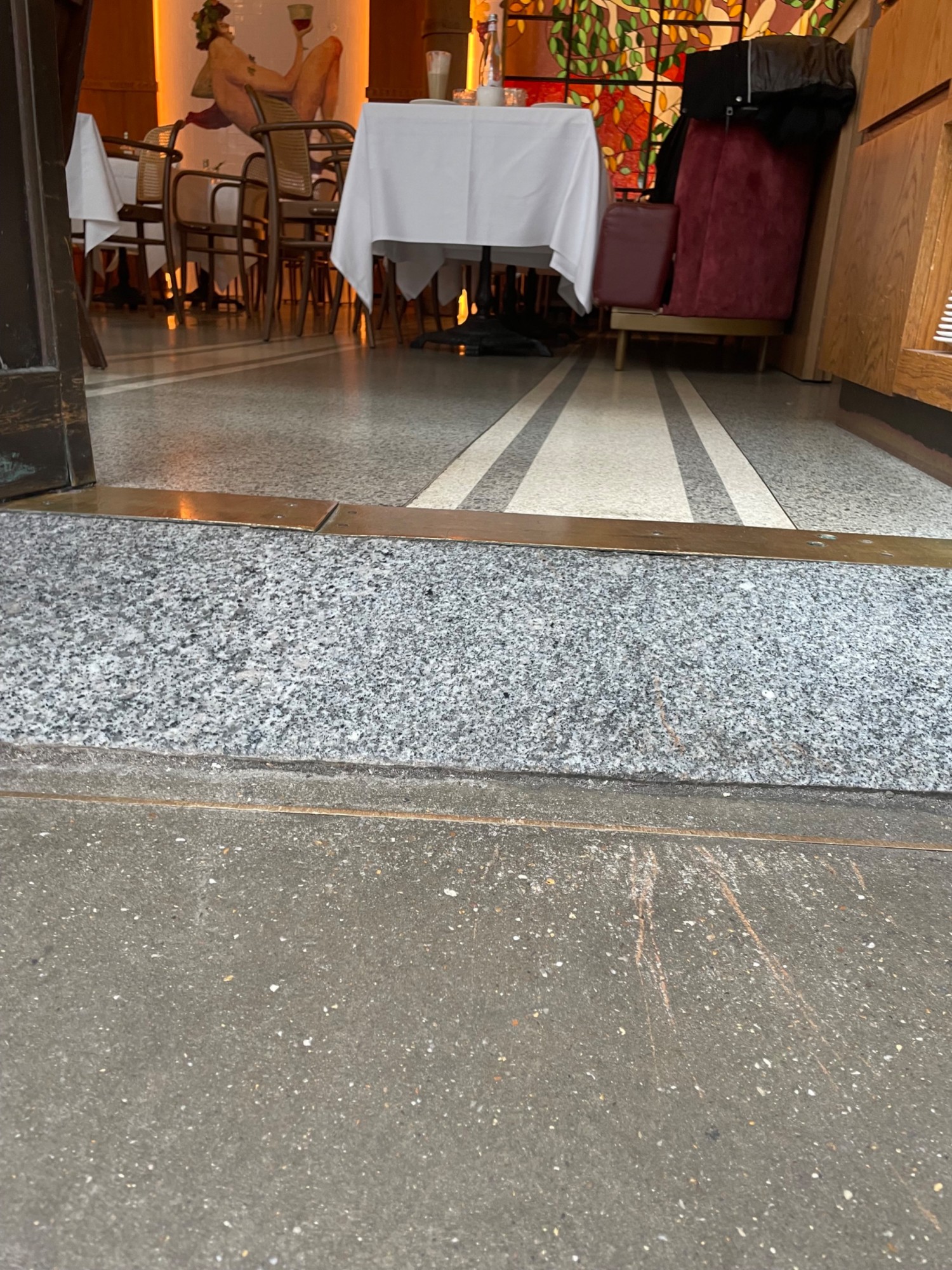 Built in ramp leading up to alternative entrance. Followed by small bump at foot of doorway.