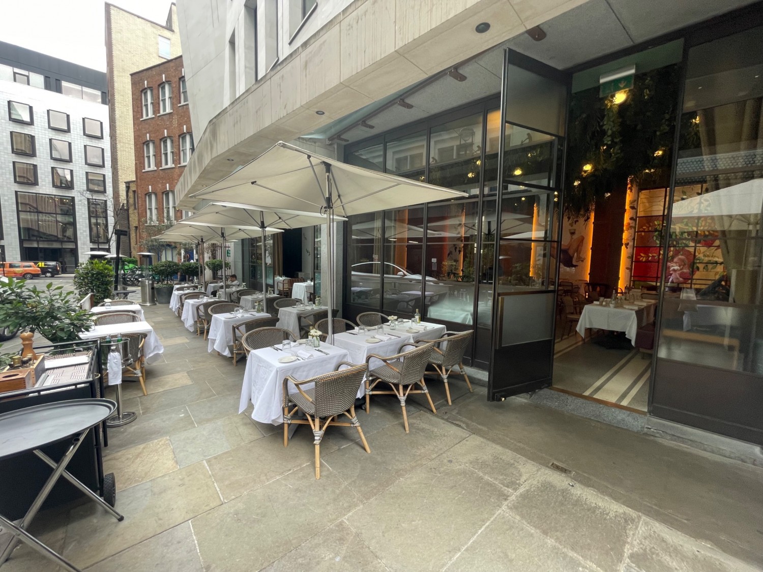 From alternative entrance looking left. Tables and chairs available to the left and right. Pathway to the middle left.