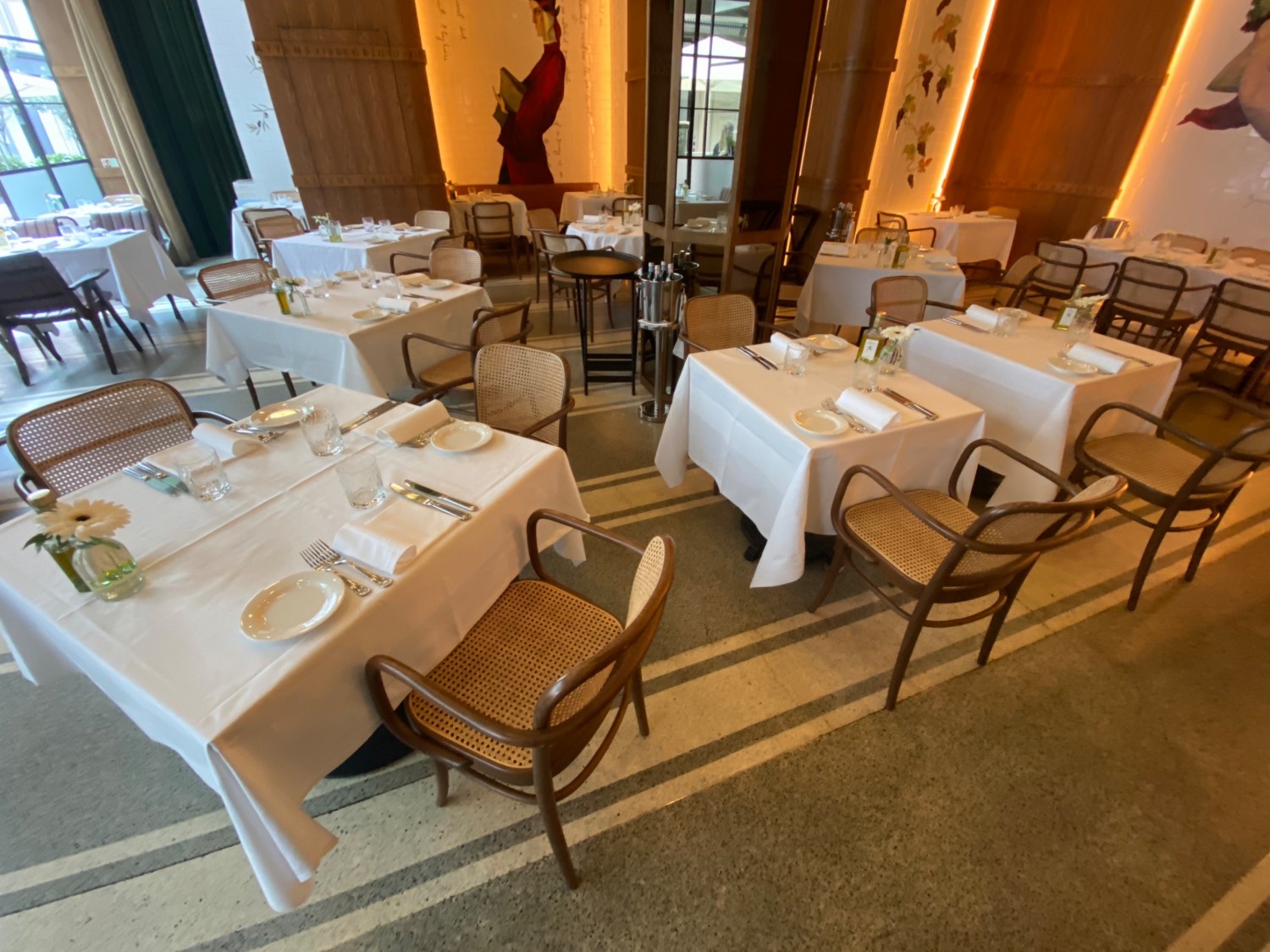 Turn right after check in counter & look left at middle section of area. Tables & chairs throughout space.