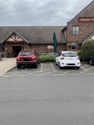 Two accessible spaces on the right. Wide space between the spaces and all around the right space.