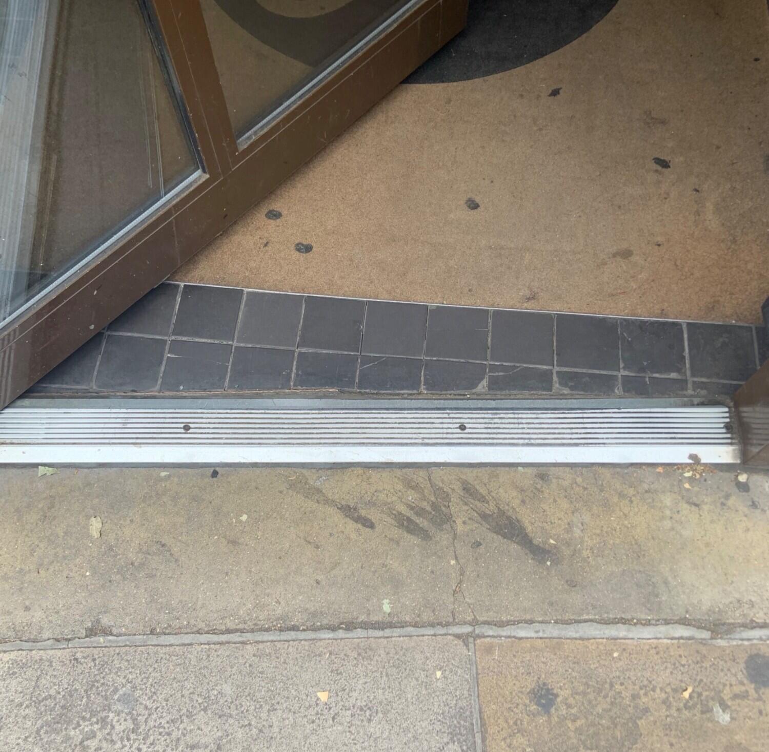 Small bump on threshold of first door. Doormat following.