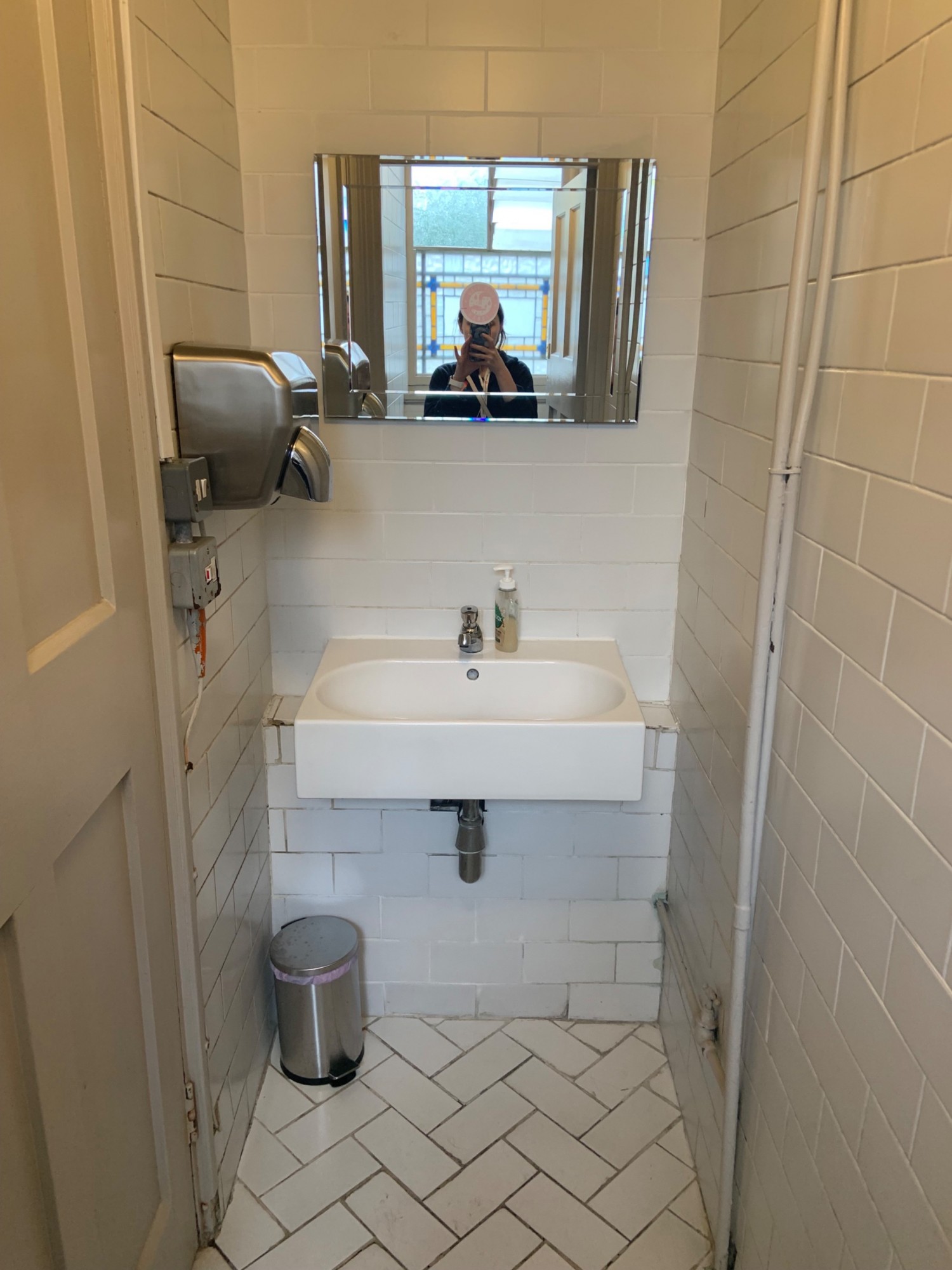 From preceding door facing left. Sink along back wall.