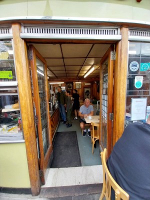 Entrance to centre of venue from outdoor area. Manual double doors push open.