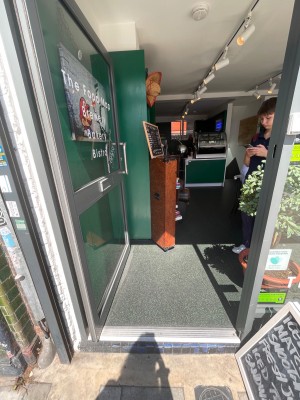 Push from right to open. One step at entrance.