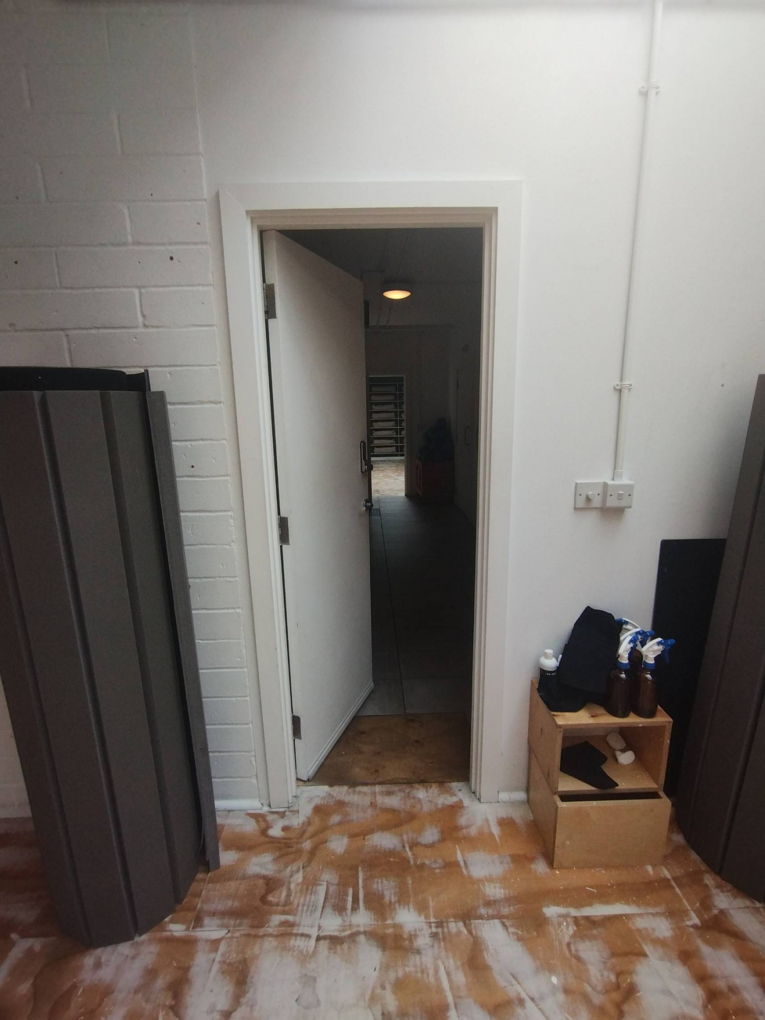 Turn left at end of path after preceding door for second preceding door. Push open to the left, handle right. Built-in ramp down after door.
