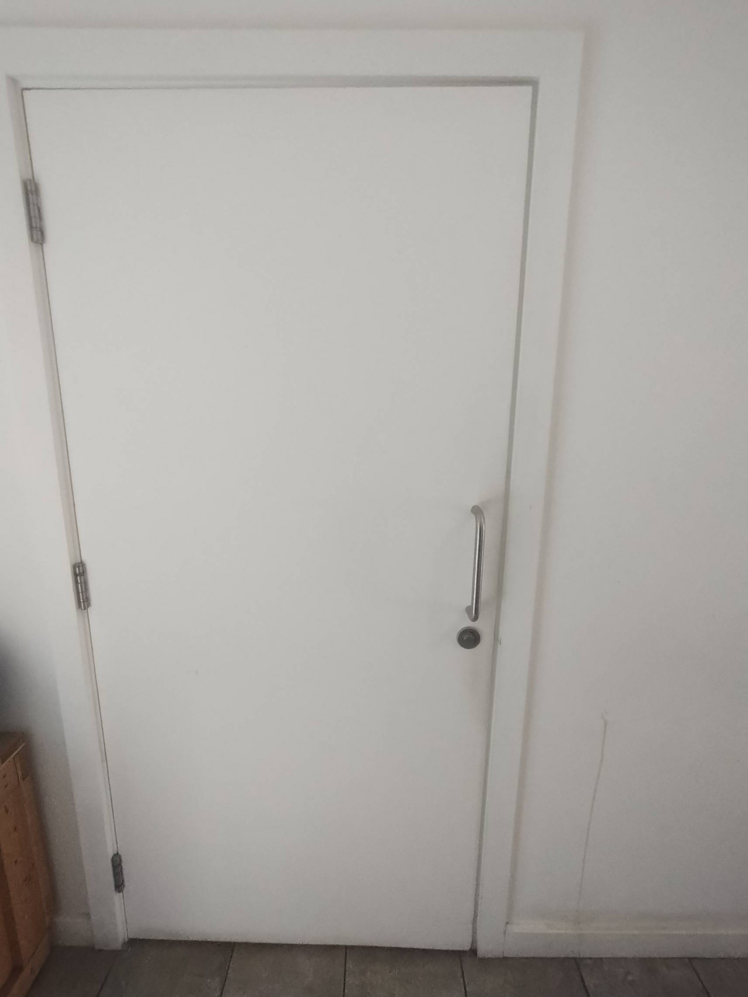 Toilet door. Pull open to the left, handle right.