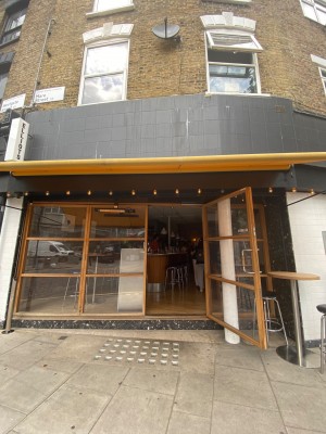 Single door opening outwards leading to the main entrance.