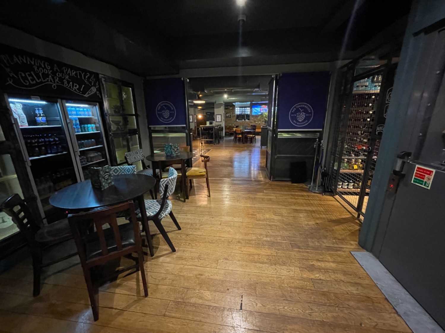From the bottom of the stair landing looking right. Tables and chairs on the left side. Central pathway in the front right lift.