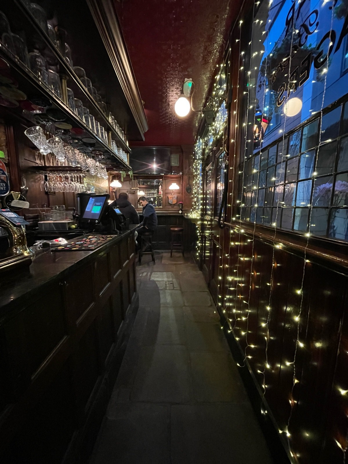 From bar facing straight. Alternative entrance on right. Path to seating continues ahead.